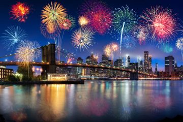 Manhattan skyline at night with fireworks, New York City, USA